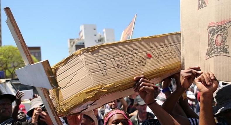 Students protest outside the parliament ahead of South African Finance Minister Pravin Gordhan's medium term budget speech in Cape Town, South Africa October 26, 2016. 