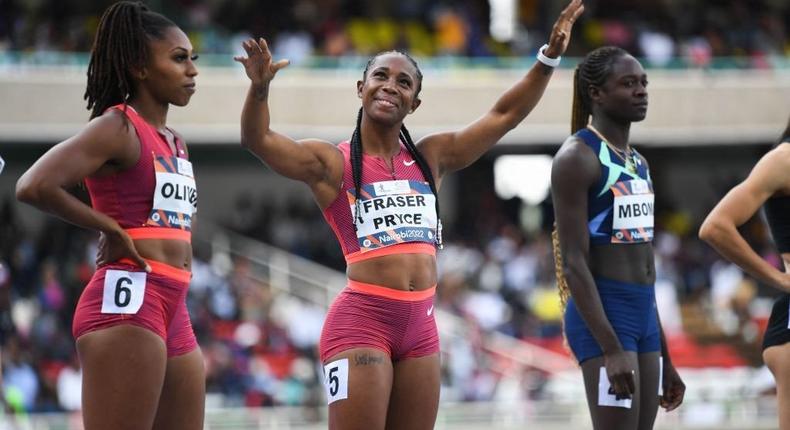Jamaica's Shelly-Ann Fraser Pryce (C) gestures before competing with USA's Javianne Olivier (L) and Namibia's Christine Mboma (R) in the women's 100m event during the Kip Keino Classic at the Kasarani stadium in Nairobi on May 7, 2022. (Photo by SIMON MAINA/AFP via Getty Images)