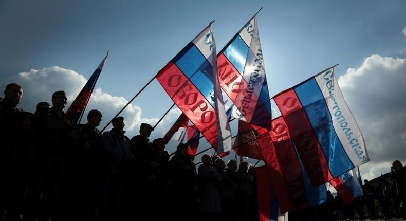 People wave Russian national flag as they celebrate the third anniversary of the annexation of the Crimea by the Russian Federation in Sevastopol in March 2017