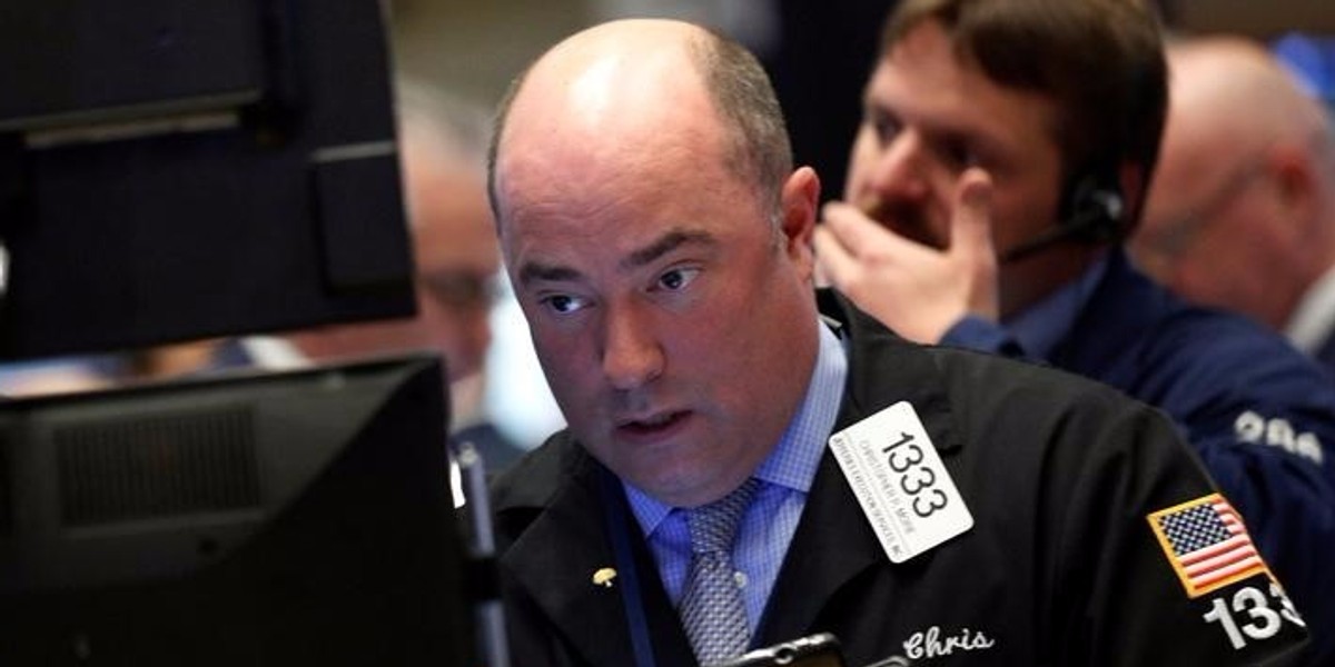 Traders work on the floor of the New York Stock Exchange (NYSE) in New York City