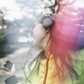 Young woman, outdoors, listening to music and dancing