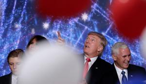 Donald Trump looks at falling balloons at the Republican National Convention in Cleveland on July 21, 2016.J. Scott Applewhite/AP