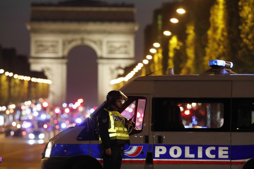 Police secure the Champs Elysees Avenue after one policeman was killed and another wounded in a shoo