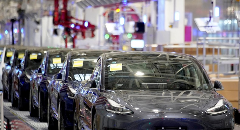 FILE PHOTO: Tesla China-made Model 3 vehicles are seen during a delivery event at its factory in Shanghai, China January 7, 2020. REUTERS/Aly Song/File Photo