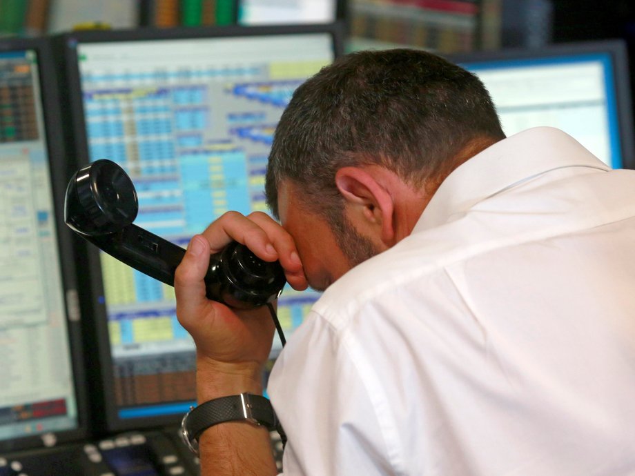 A trader from BGC, a global brokerage company in London's Canary Wharf financial centre reacts during trading June 24, 2016 after Britain voted to leave the European Union in the EU BREXIT referendum.