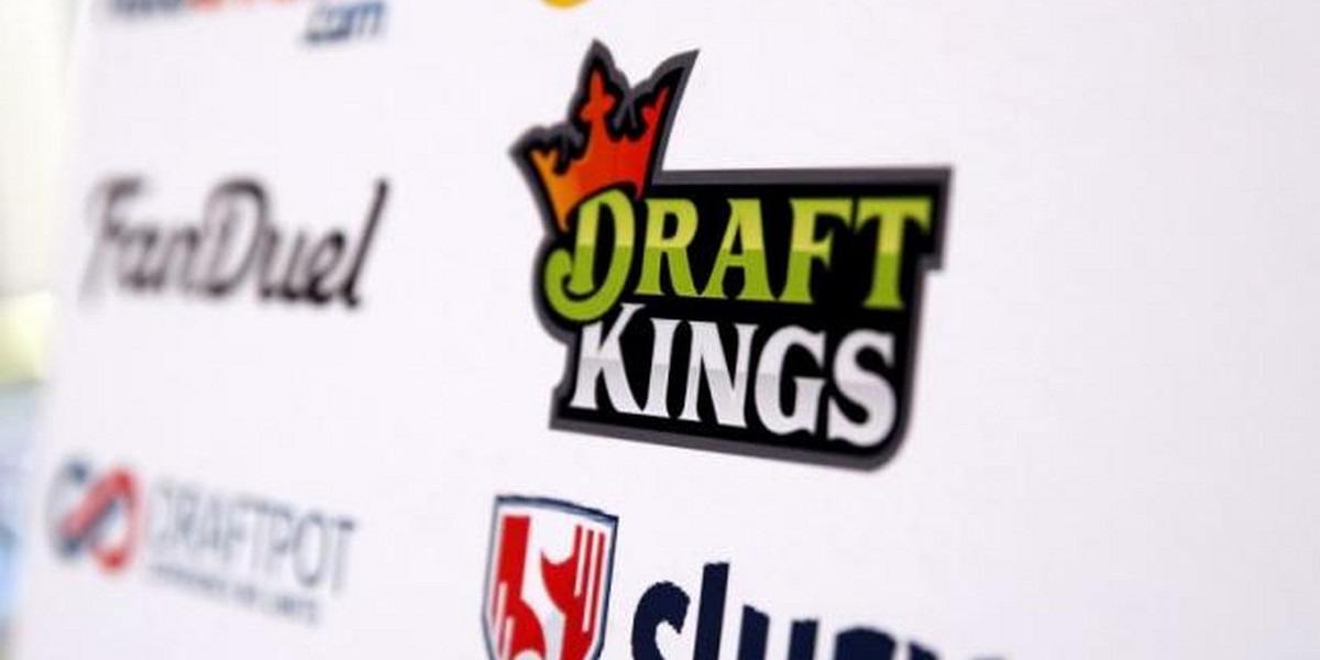 A DraftKings logo is displayed on a board inside of the DFS Players Conference in New York November 13, 2015.