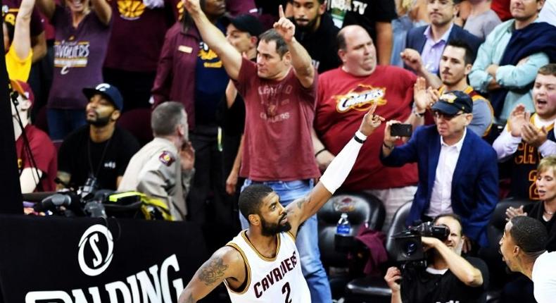 Kyrie Irving celebrates the Cleveland Cavaliers 112-99 win over the Boston Celtics at the Quicken Loans Arena in Cleveland, Ohio