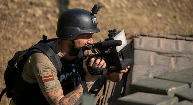 A Latvian TV journalist films Ukrainian tank crew members near Bakhmut on June 7, 2023 in Donetsk Oblast, Ukraine.(Photo by Viktor Fridshon/Global Images Ukraine via Getty Images)