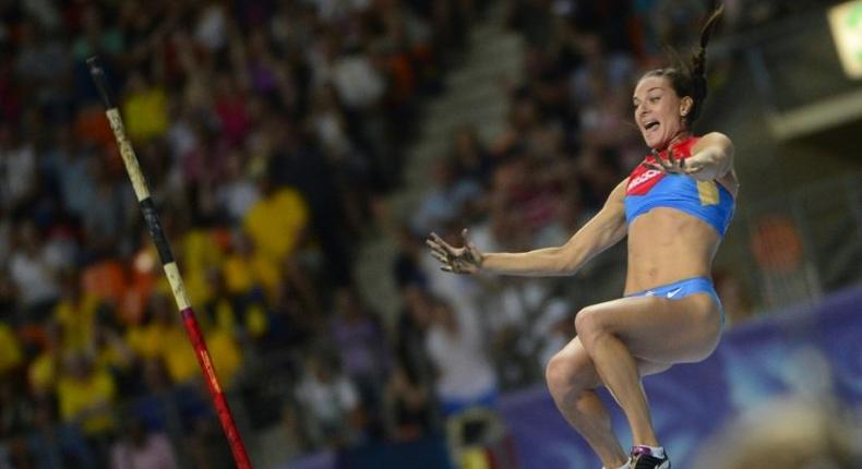 Russia's Yelena Isinbayeva celebrates as she clears the bar during the women's pole vault final at the 2013 IAAF World Championships at the Luzhniki stadium in Moscow on August 13, 2013