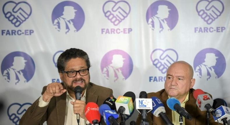 FARC commanders Ivan Marquez (L) and Carlos Lozada deliver a press conference announcing the launching of their political party in Bogota on July 24, 2017.The FARC guerrillas announced Monday they will launch a legal political party on September 1