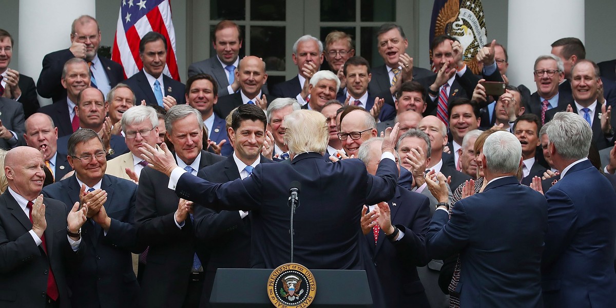 President Donald Trump congratulates House Republicans after they passed legislation aimed at repealing and replacing ObamaCare, during an event in the Rose Garden at the White House.