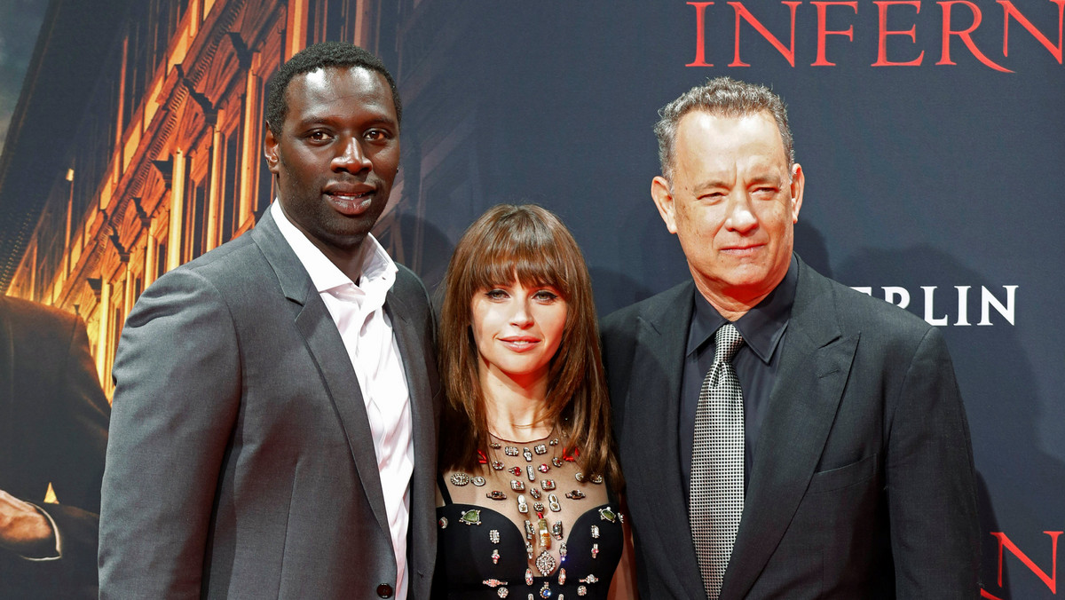 Actors Omar Sy, Felicity Jones and Tom Hanks pose at a screening of "Inferno" in Berlin