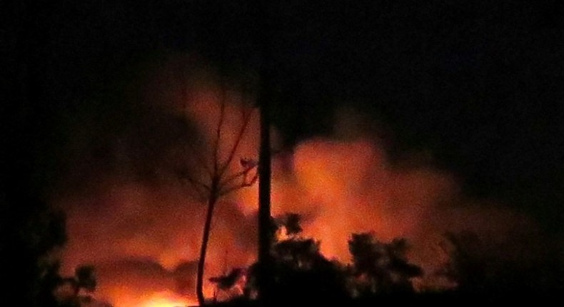 Flames and smoke rise from the Mazzeh airbase on the outskirts of Damascus following what the Syrian army said were Israeli missile strikes