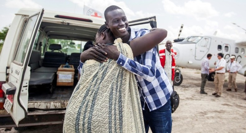 Emmanuel, 17, hugs his mother as they reunite in Aburoc, South Sudan after more than three years, forced apart by the civil war which began in 2013