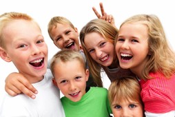 Group of excited young children laughing 