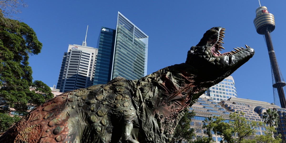 In this handout provided by Destination New South Wales, a Tyrannosaurus rex takes a morning stroll with commuters in Hyde Park on August 28, 2013, in Sydney, Australia.