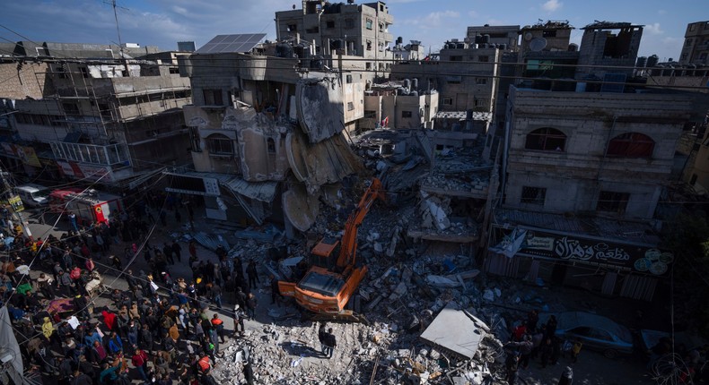 Palestinians search for bodies and survivors in the rubble of a residential building destroyed in an Israeli airstrike in Rafah, Gaza Strip, on March 4, 2024.Fatima Shbair/AP