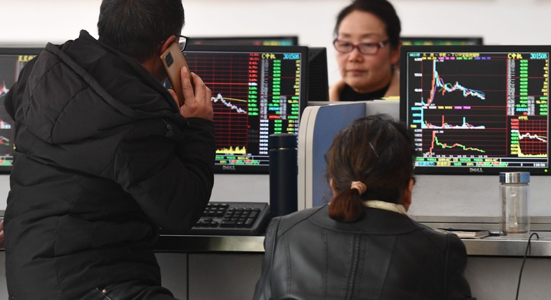 Investors are paying attention to the stock market at a securities business hall in Fuyang, China, on December 5, 2023.Costfoto/NurPhoto/Getty Images