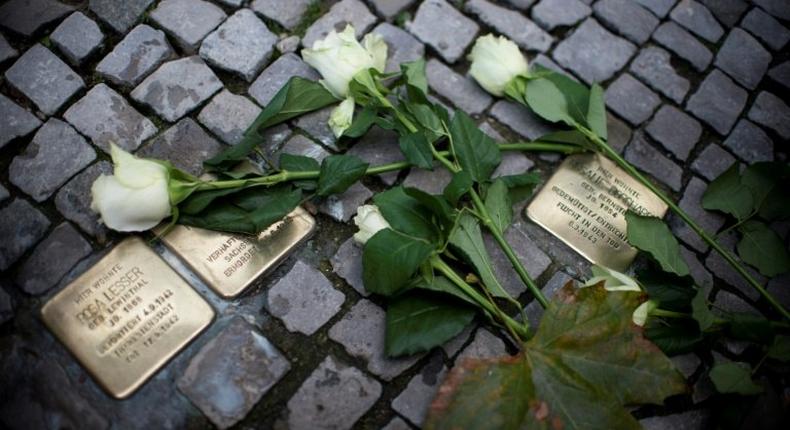 In recent years across Germany on November 9, people have polished brass plaques embedded in pavements bearing the names of Jewish victims