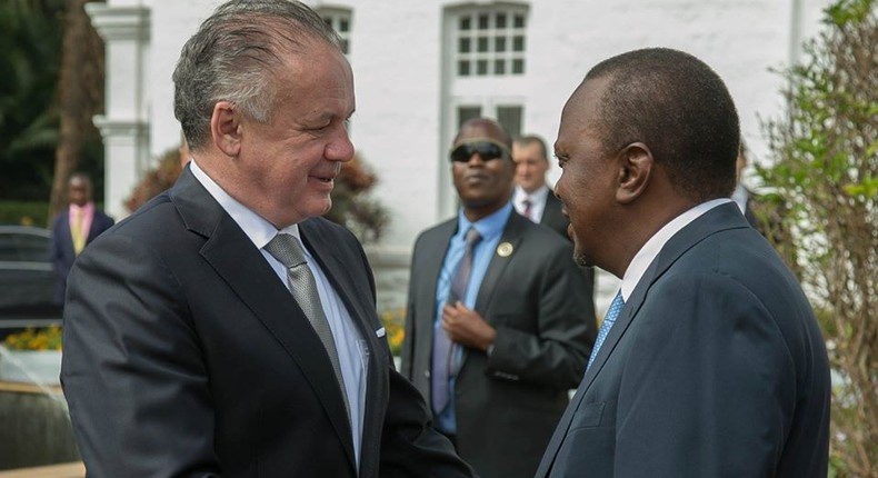 The President of Slovakia, Andrej Kiska (left) is received by his host President Uhuru Kenyatta at State House, Nairobi.