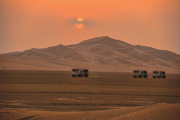 Saudi Aramco's trucks are seen during exploration in the Empty Quarter