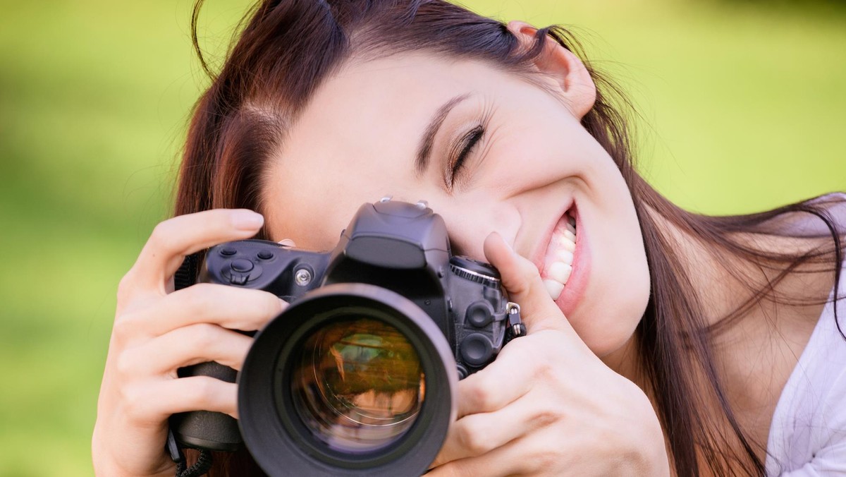 Beautiful girl with camera