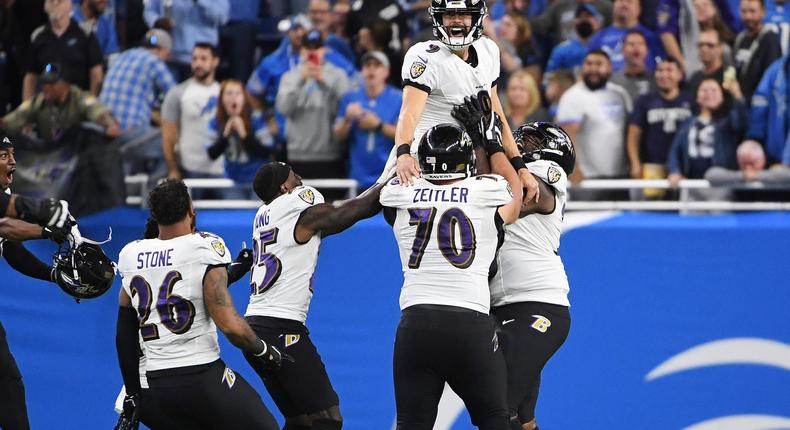 Baltimore Ravens placekicker Justin Tucker celebrates with teammates after hitting a game-winning field goal and breaking the NFL record in 2021.Nic Antaya/Getty Images