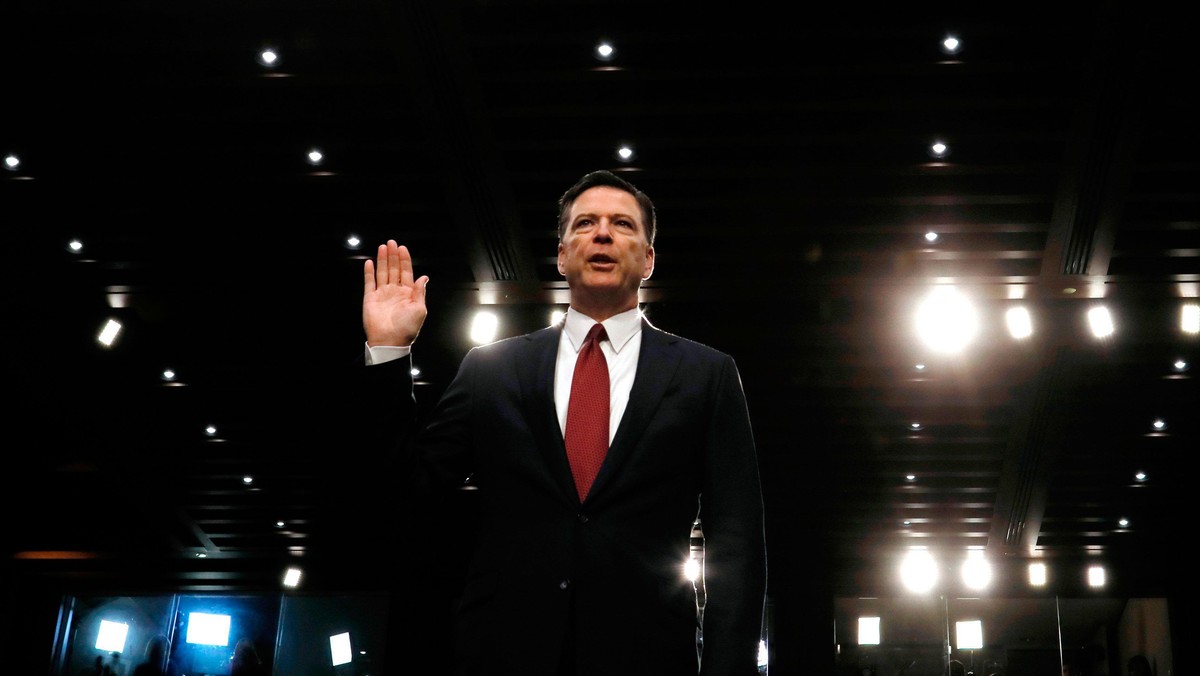 Former FBI Director James Comey sworn in to testify at a hearing in Washington