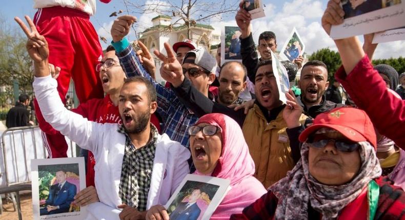 Moroccans demonstrate outside a court on March 13, 2017 against the killing of security forces in the Western Sahara in 2010