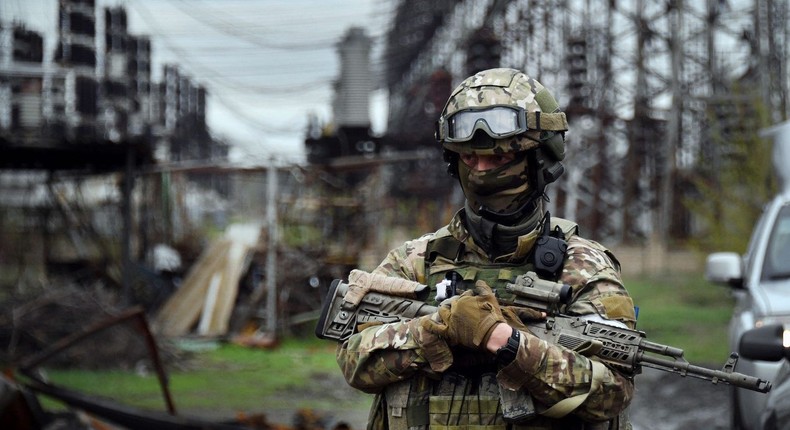 A Russian soldier stands guard at the Luhansk power plant in the town of Shchastya, Ukraine.