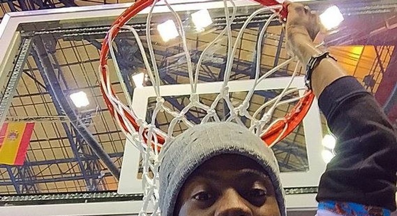 Korede Bello holding on to the rim