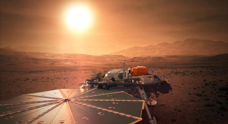 An illustration of NASA's InSight probe with its solar panels unfurled on Mars' surface.