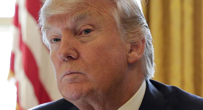 President Donald Trump sits during a meeting with Chief Executive Officer of Intel Brian Krzanich in the Oval Office of the White House in Washington, U.S., February 8, 2017.