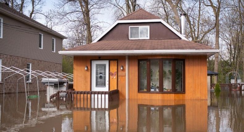 A flooded home in the Montreal borough of Pierrefonds. Floods and heavy rains have led to evacuations and caused extensive damage in waterlogged eastern Canada