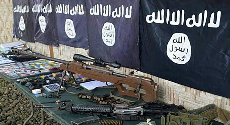 Weapons and IS flags recovered from members of Ansarul Khilafa in November, 2015 -- the group is one of several violent Islamic militant groups in the southern Philippines