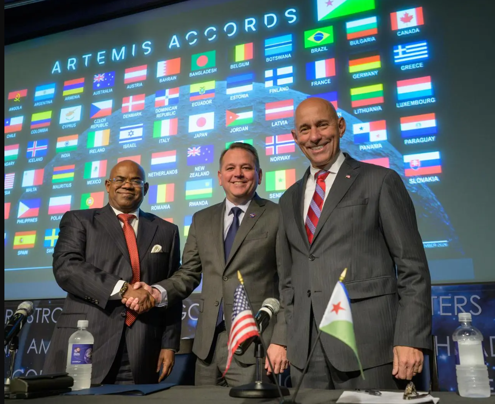 NASA Deputy Administrator Matt Anderson, Ambassador Mohamed Siad Douale, and Assistant Secretary of State for African Affairs, Frank Garcia, at the Artemis Accord signing, (NASA/Bill Ingalls)