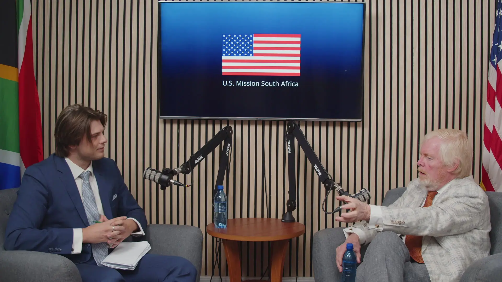US Ambassador Leo Brent Bozell III [right] with Gabriel Makin (left)The Common Sense host. Mr Bozell says South Africa’s ownership requirement has stalled Starlink’s entry. [Image via US Embassy]