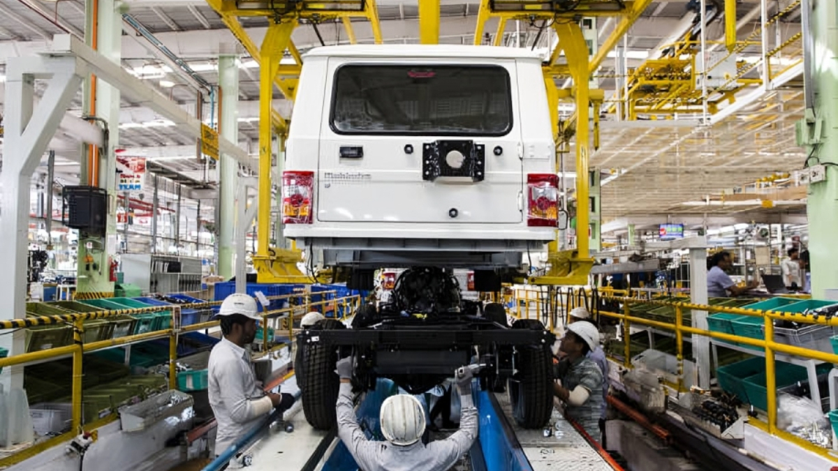 Employees assemble components to a Mahindra & Mahindra Ltd. sport-utility vehicle (SUV) on the production line at the company's facility in Chakan, Maharashtra, India. [Photo by Udit Kulshrestha/Bloomberg via Getty Images]