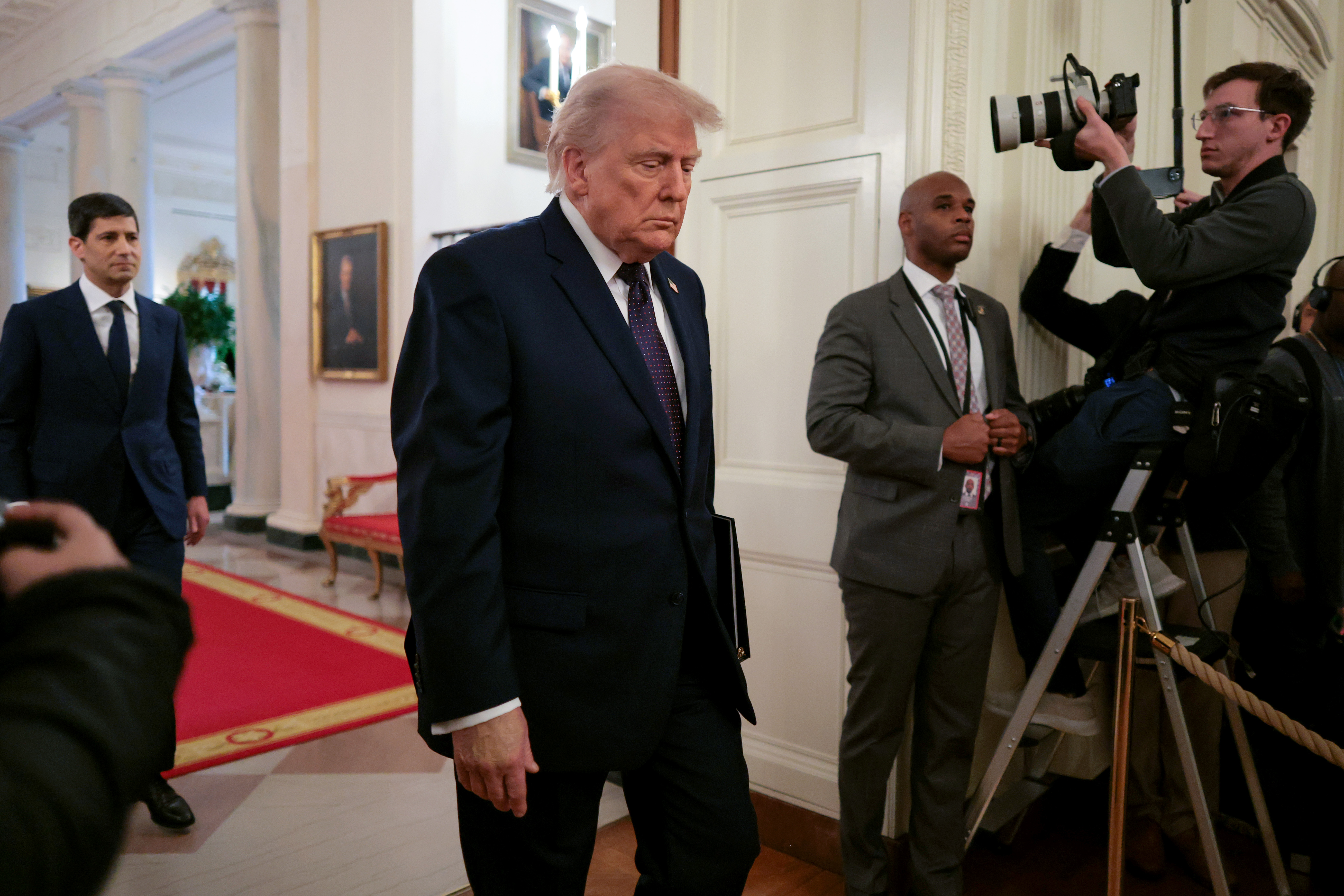 Chair of the Federal Reserve Kevin Warsh, left, and U.S. President Donald Trump arrive to Warsh's swearing-in ceremony in the East Room of the White House on May 22, 2026, in Washington, D.C.