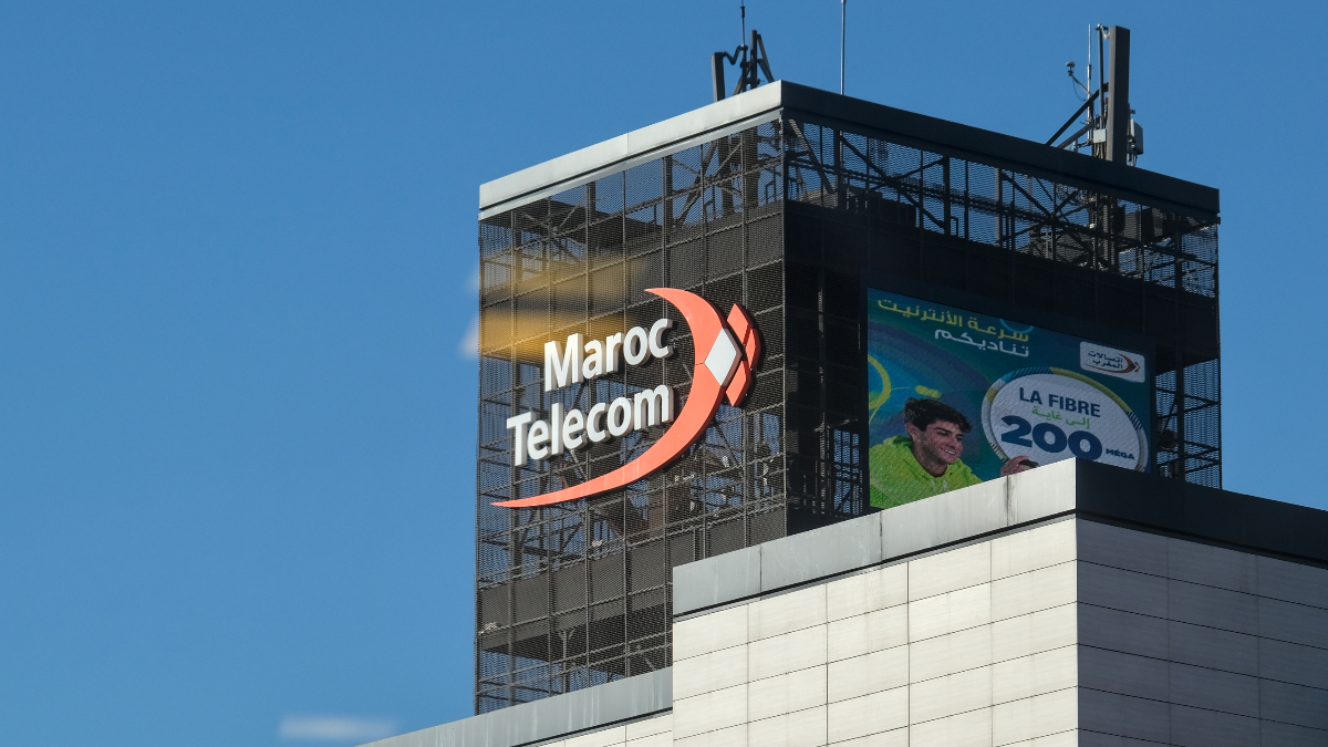 The Maroc Telecom building, with its logo, featuring modern architecture and a large advertisement for fiber internet against a blue sky. [Stock Photo/Getty Images]