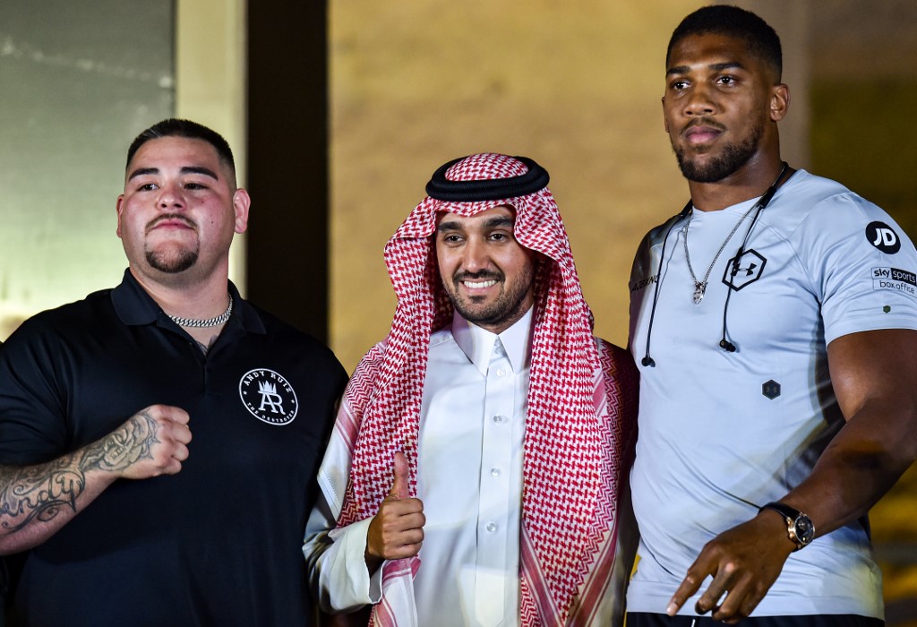 Joshua, right, and Ruiz, left, posing with Saudi Arabia's General Sports Authority Chief Prince Abdulaziz bin Turki Al-Faisal (AFP)