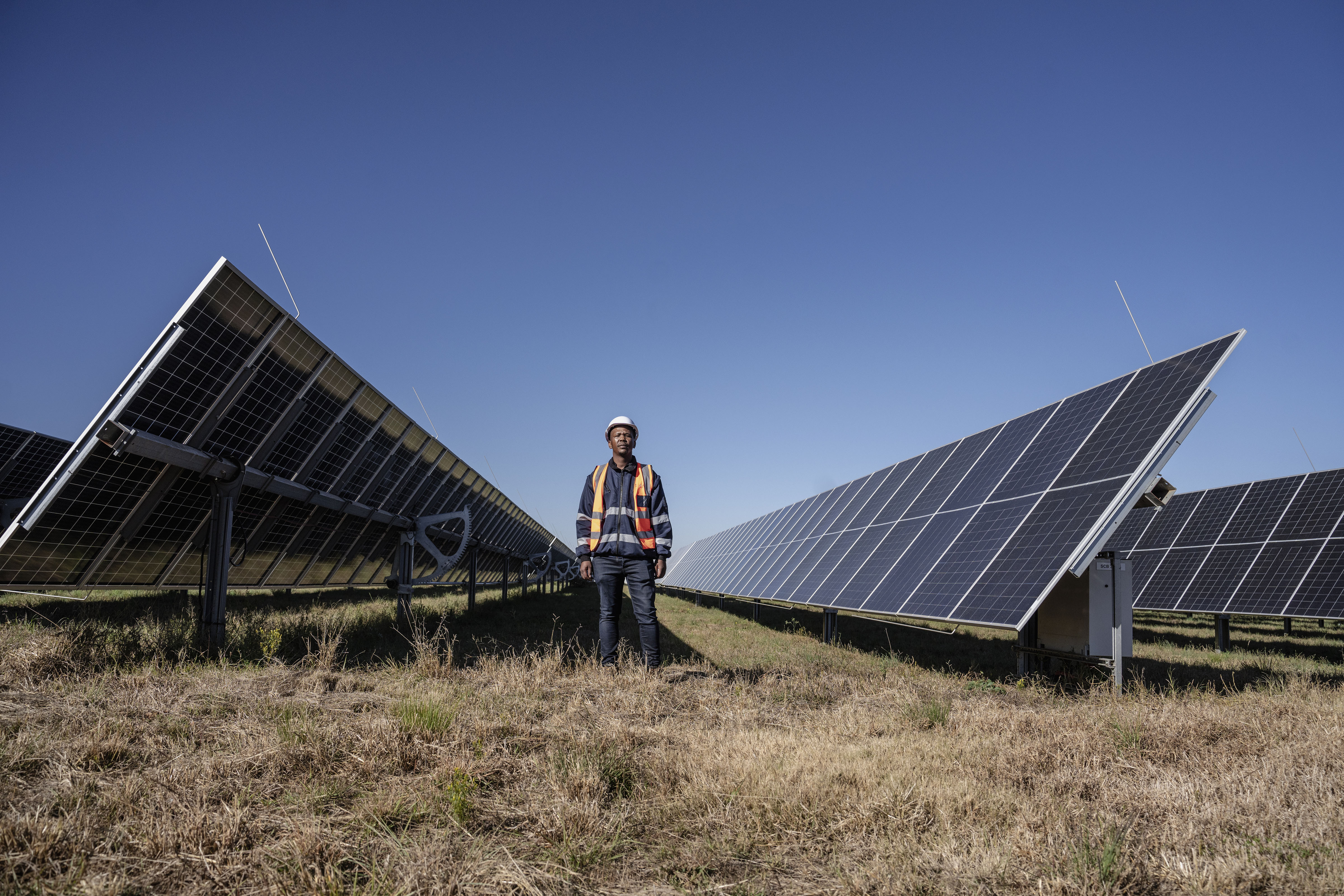 A man is seen near a Solar Power Plant in South Africa on May 8, 2025. [Photo by Ihsaan Haffejee/Anadolu via Getty Images]
