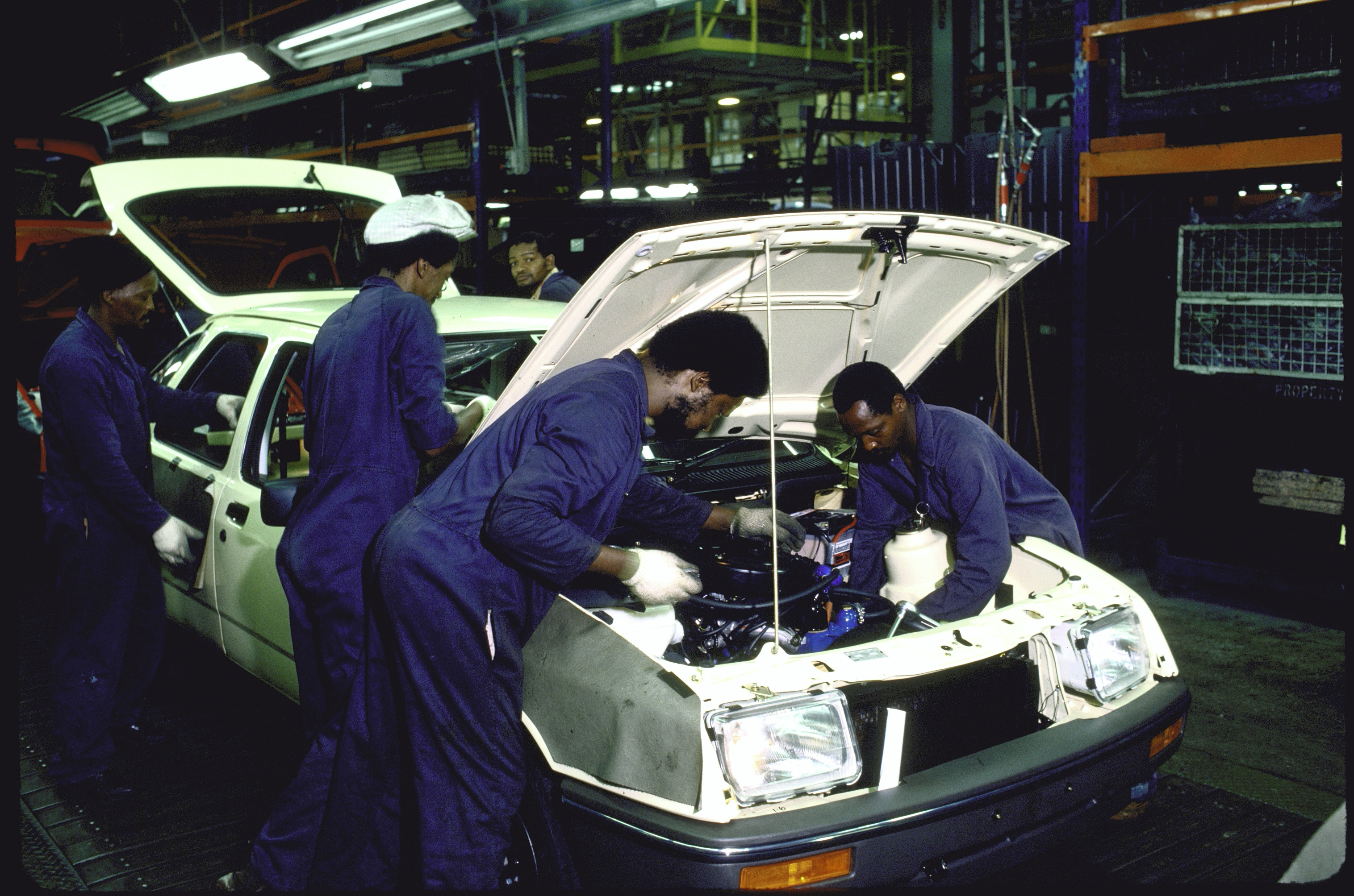 South African natives at Ford’s assembly plant in Port Elizabeth - most of the 500 job cuts will take place in the Silverton assembly plant in Pretoria, following a slump in European demand for the Ranger pickup. [William F. Campbell/Getty Images]
