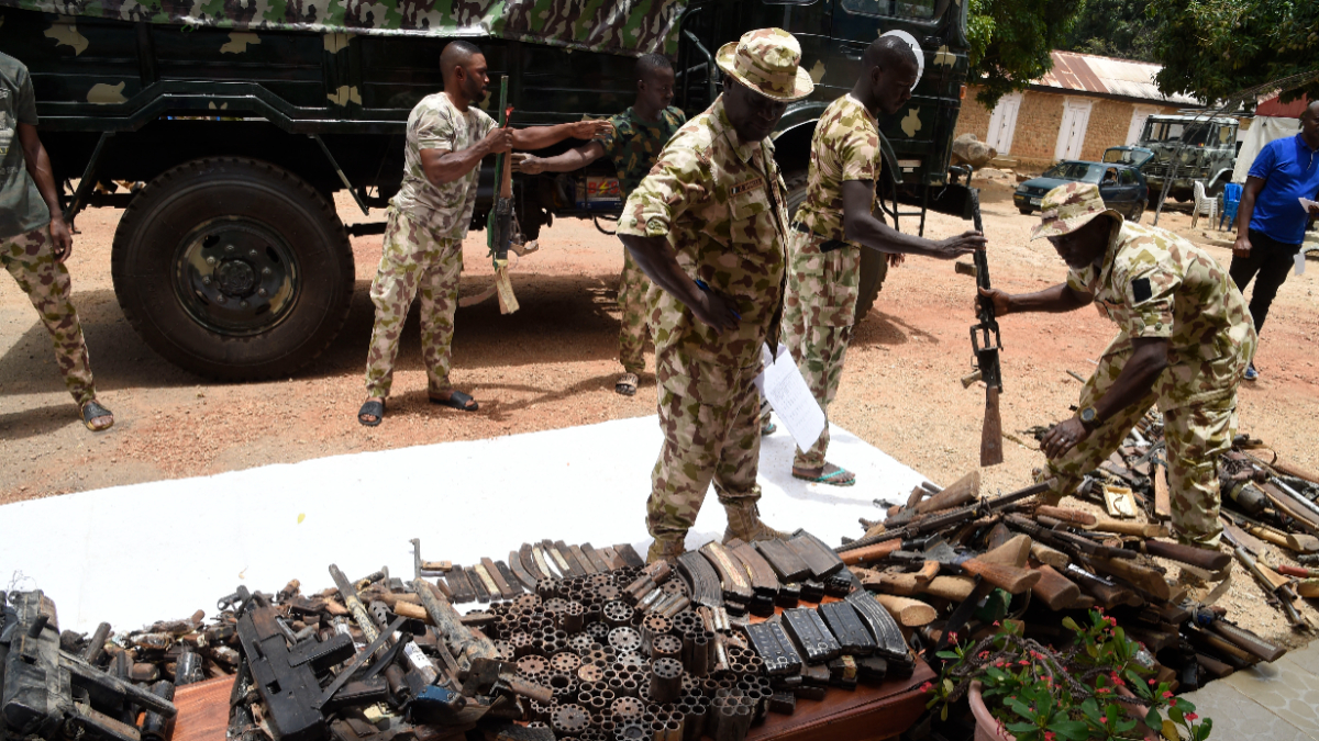 Nigerian soldiers make an inventory on April 21, 2022 of small arms and light weapons recovered from bandits during Operation Safe Haven and during the military mop up in Jos and surrounding areas in Plateau State in northcentral Nigeria. [Photo by PIUS UTOMI EKPEI/AFP via Getty Images]
