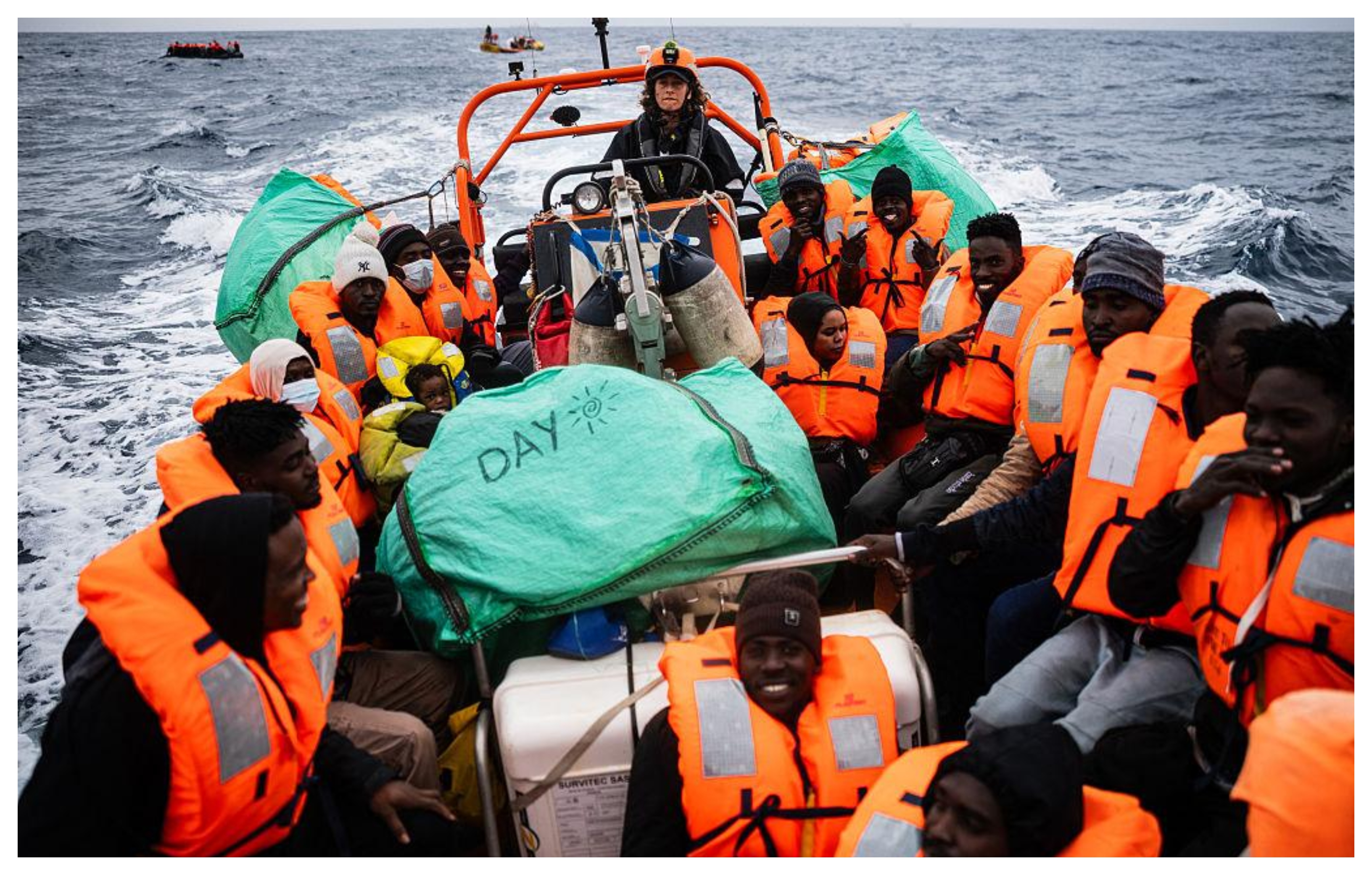 Migrants wearing life jackets are rescued in the Mediterranean after attempting to cross from Libya towards Italy. Photo: AFP/Getty Images.