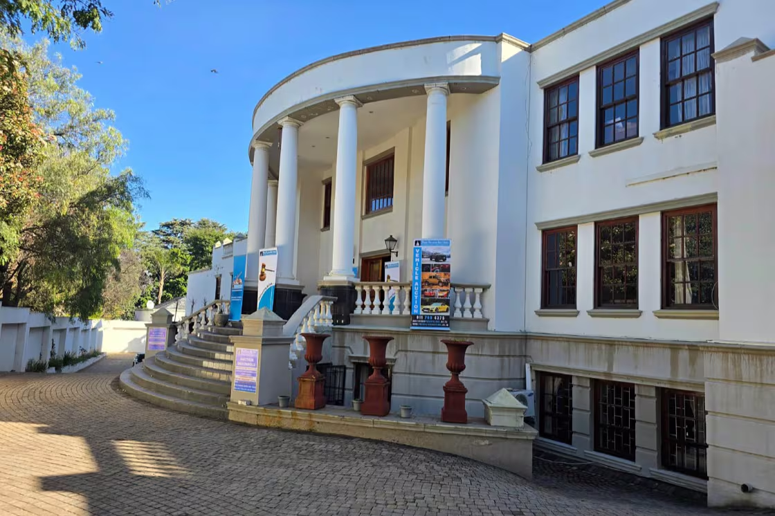 The grand entrance at number 5 Saxonwold Drive, part of the Gupta compound, seen 24 July 2025. PC: Michel Bega/The Citizen
