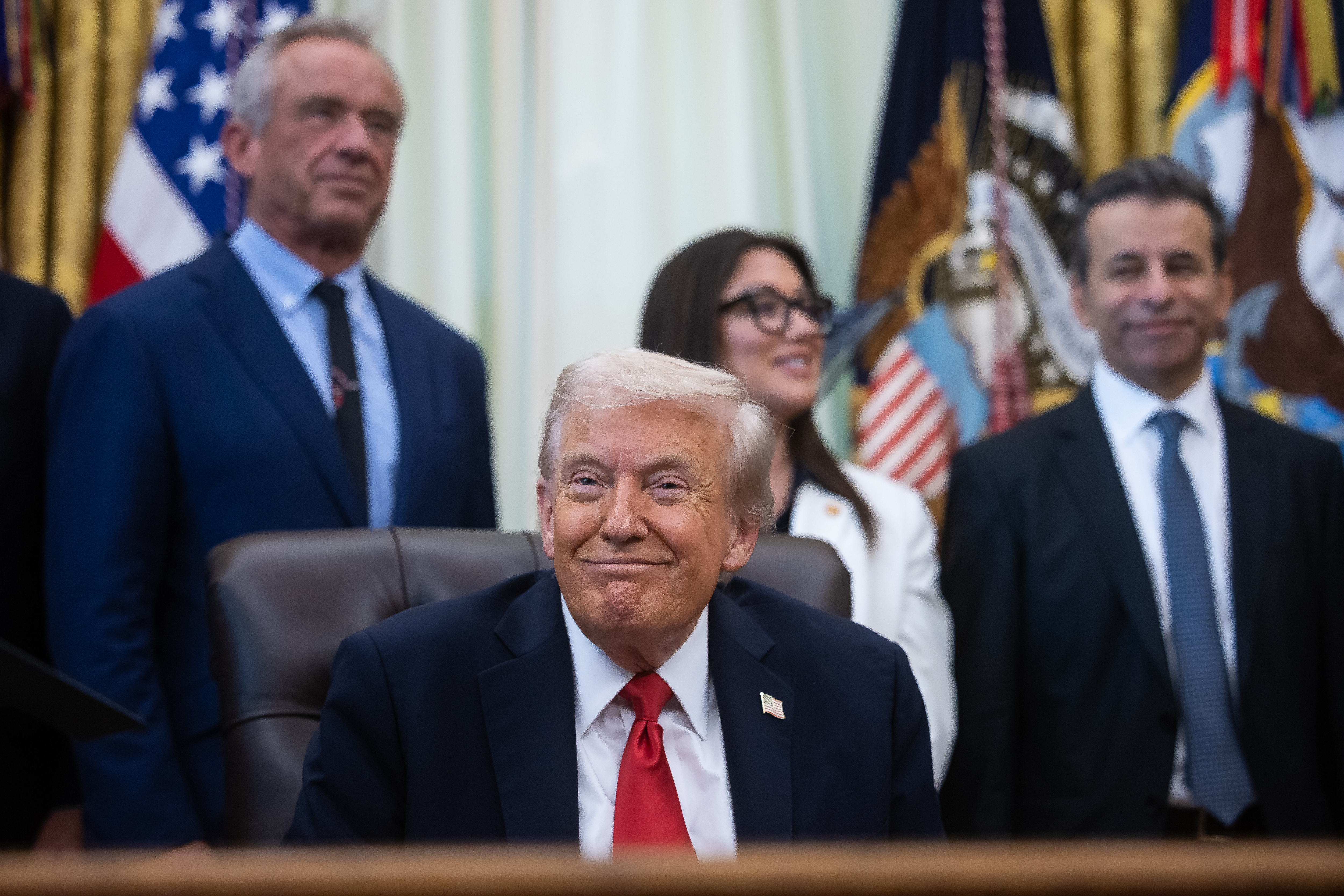 President Donald Trump looks on with guests during an annoucement about in vitro fertilization in the Oval Office at the White House Oct. 16, 2025. (Francis Chung/POLITICO via AP Images)