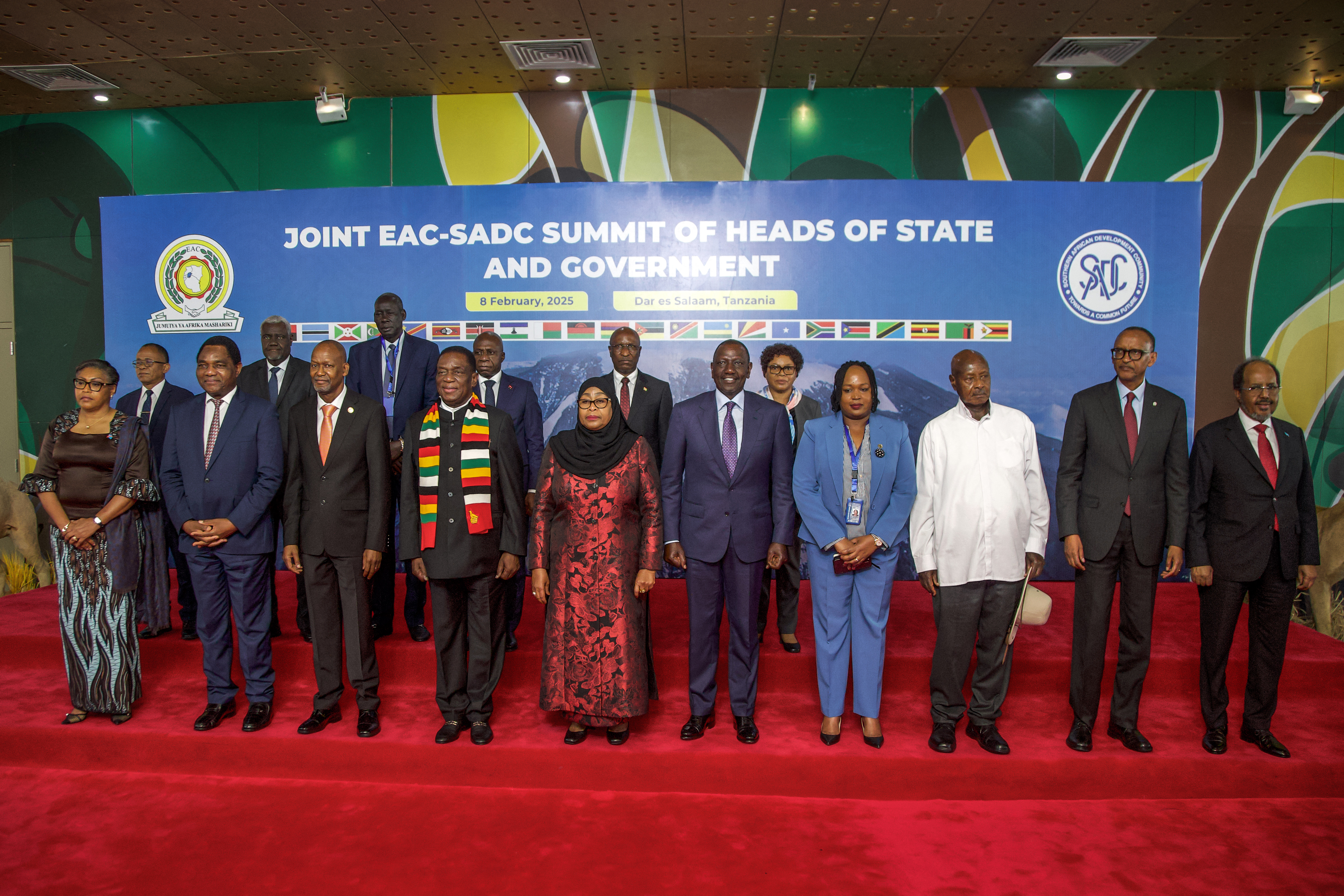 Heads of state from the Southern African Development Community (SADC) and the East African Community (EAC) pose for a group photo before attending the Extraordinary Joint Regional Summit at the State House in Dar es Salaam on February 8, 2025. [Photo by ERICKY BONIPHACE/AFP via Getty Images]