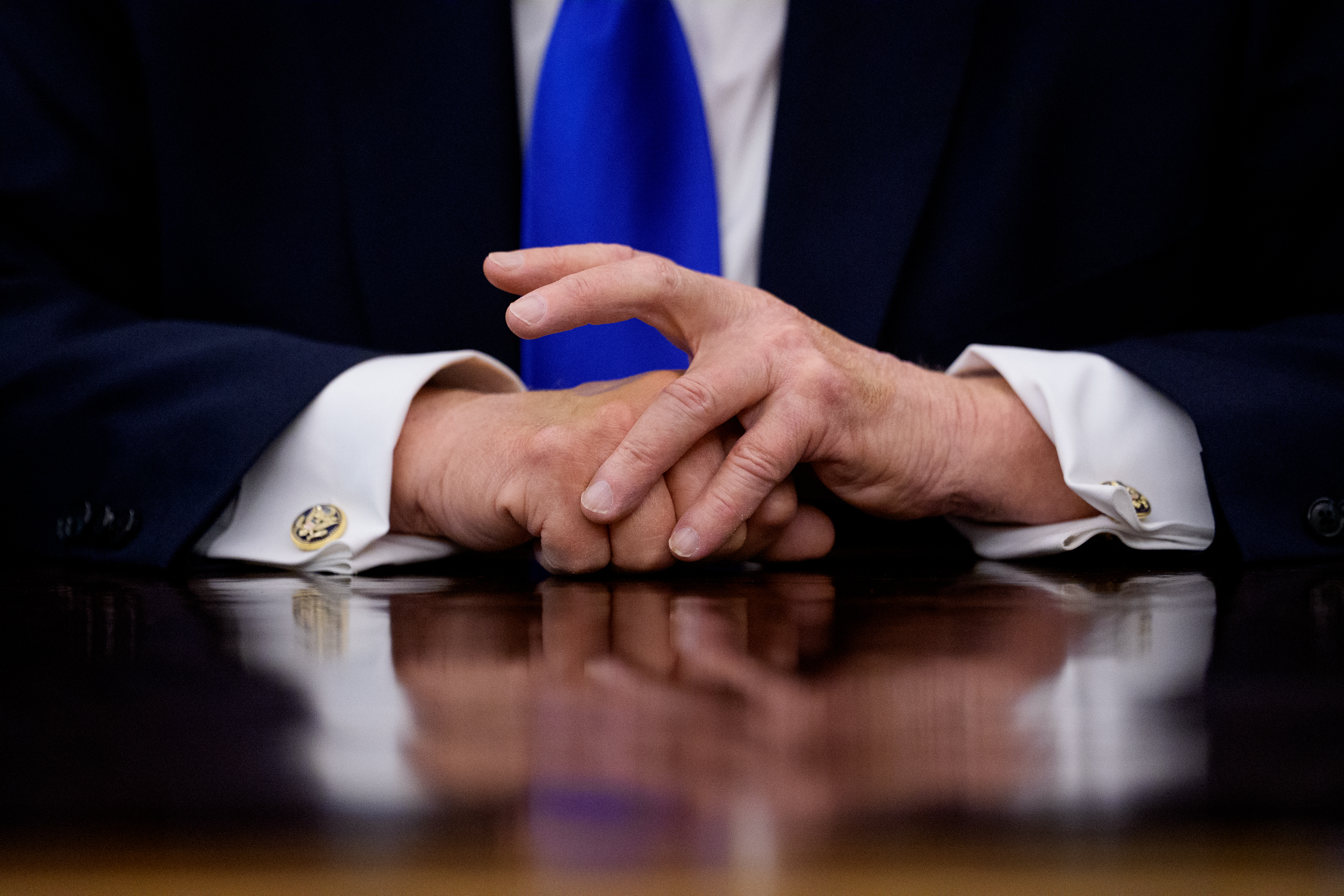 President Donald Trump speaks to member of the media after signing executive orders in the Oval Office of the White House on April 30, 2026 in Washington.