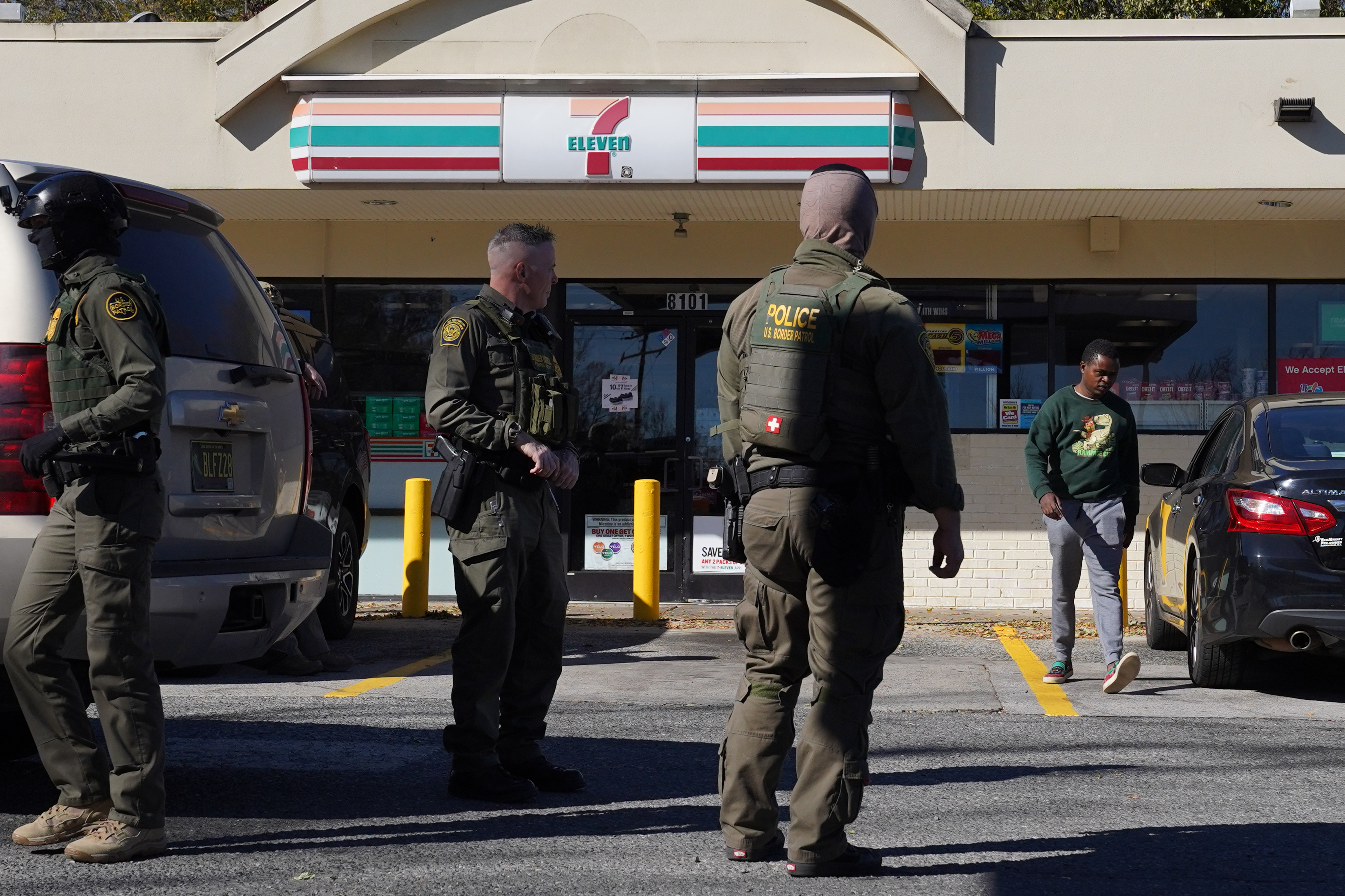 Border Patrol chief Greg Bovino and other federal agents patrol outside a 7-Eleven in search of undocumented immigrants Nov. 17, 2025, in Charlotte, North Carolina.